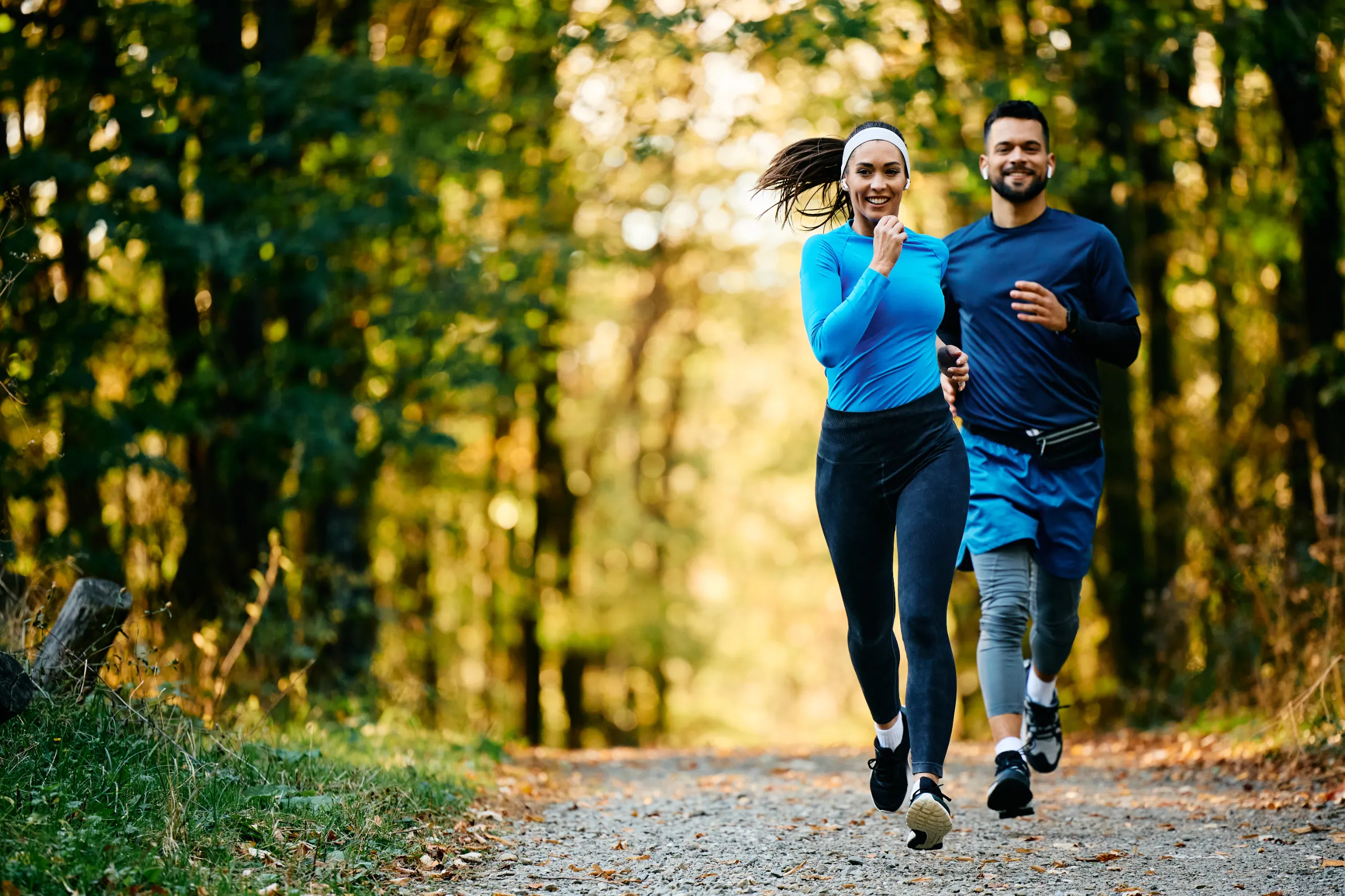 athletic woman and her friend jogging while workin utc